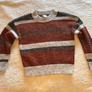 Polyester/acrylic sweater, size small.